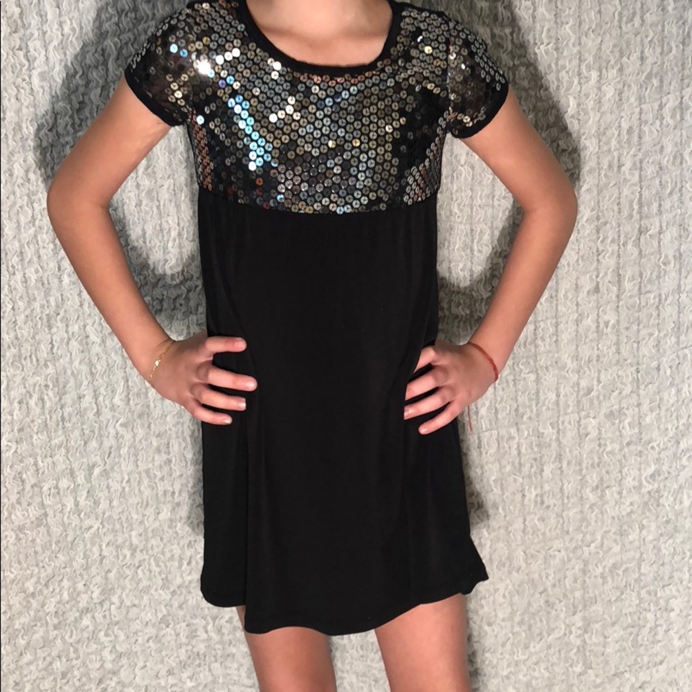 Black dress with silver sequins for girls.